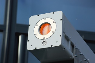 QLM's quantum-based LiDAR (laser imaging, detection, and ranging) camera, a rectangular metal tube with a round orange lens